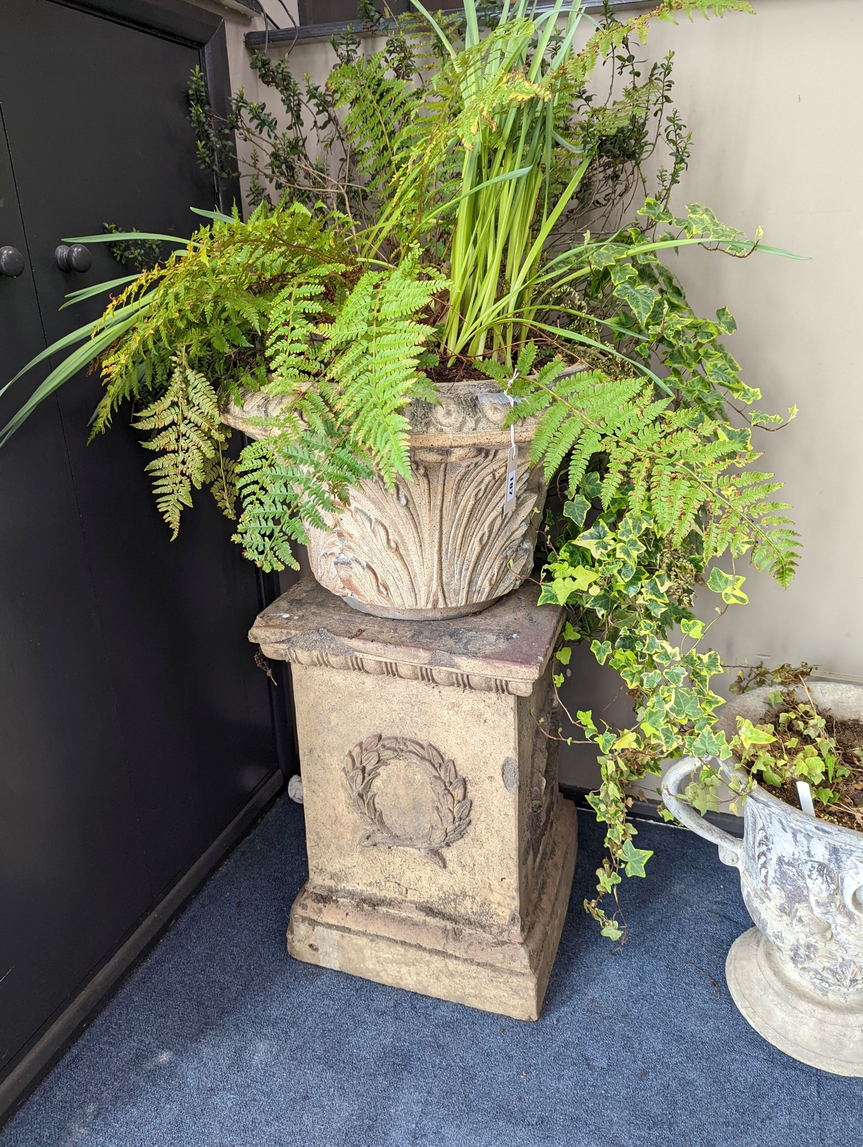 A pair of Victorian earthenware circular garden urns square plinth bases, diameter 58cm, height 96cm